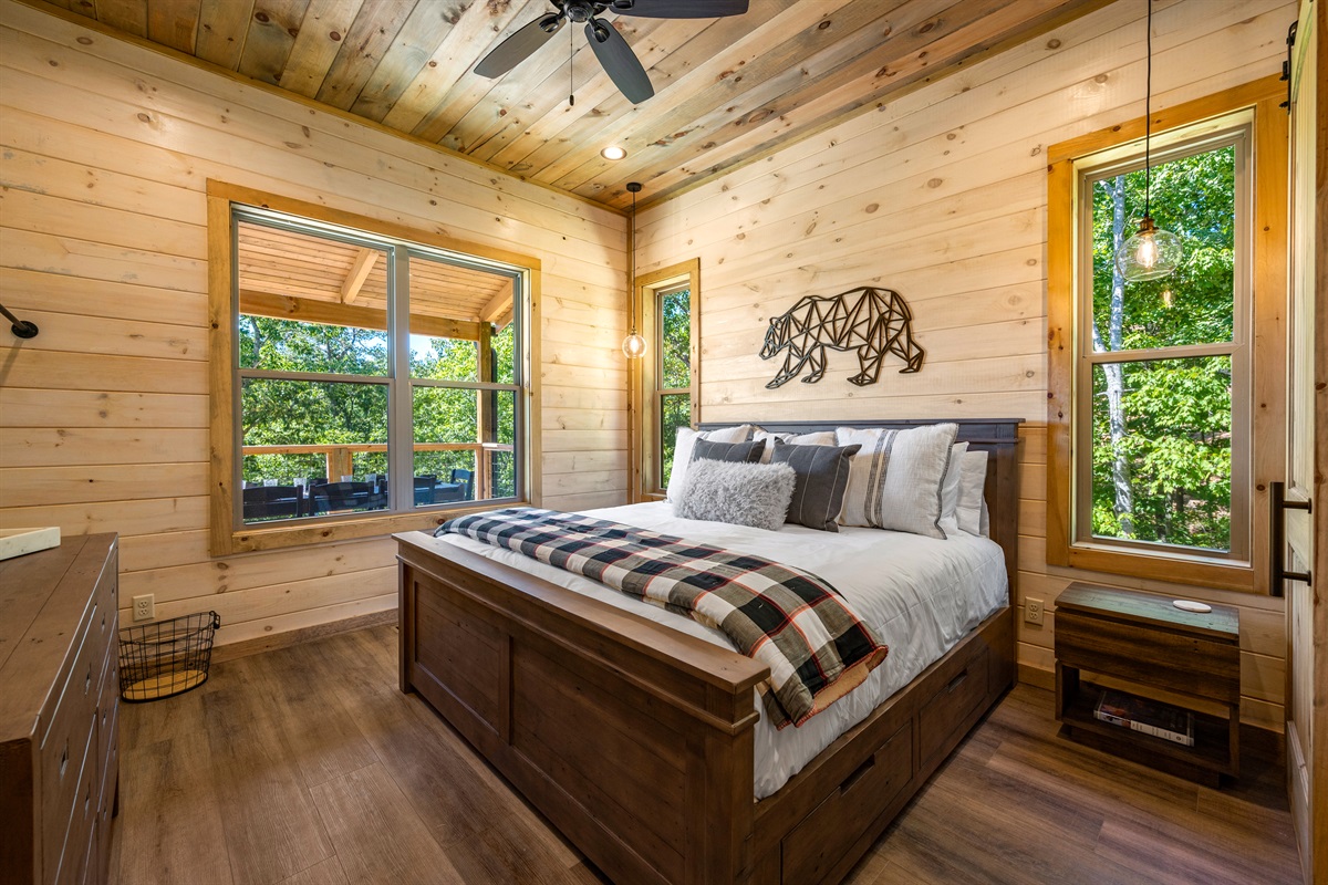 The main level suite has a comfy king sized bed and a connected bathroom.
