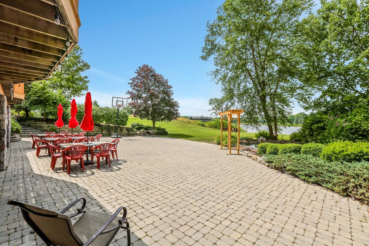 Back Patio walking out to the lakefront. Plenty of seating and even a basketball hoop!