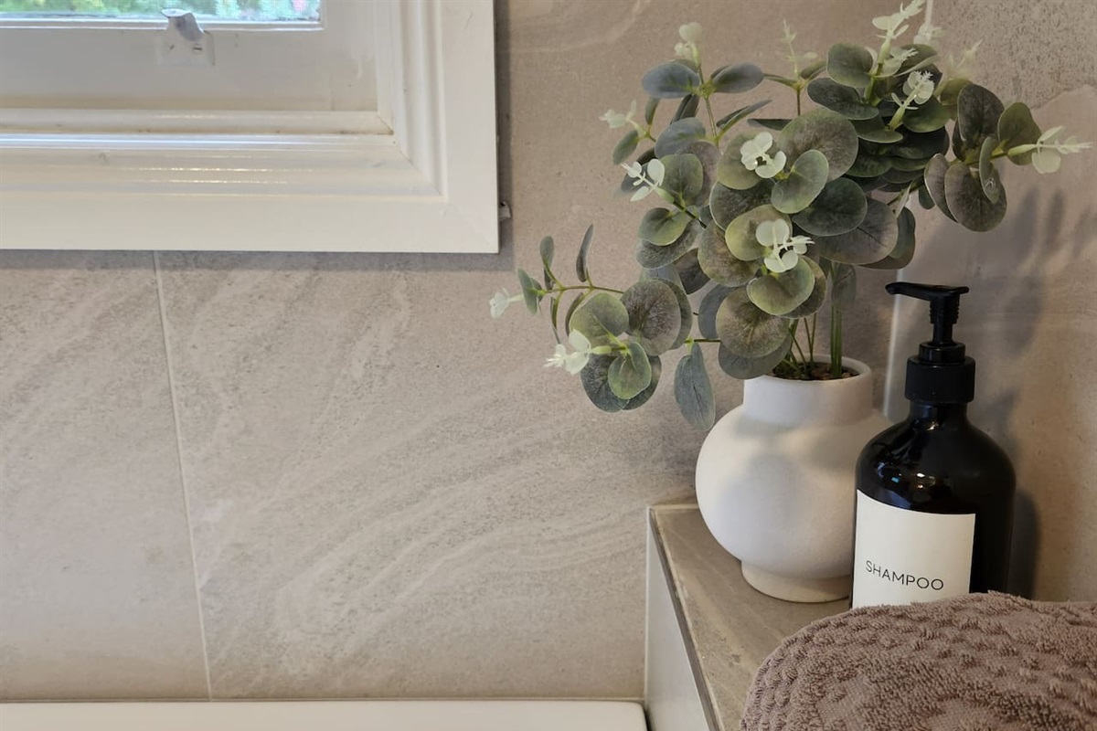 One bathroom has a shower, vanity and toilet. The second bathroom has a large bath, 4-drawer vanity and toilet. Soaps and shampoos are supplied. There is a washing machine, dryer, ironing board and iron in the second bathroom.