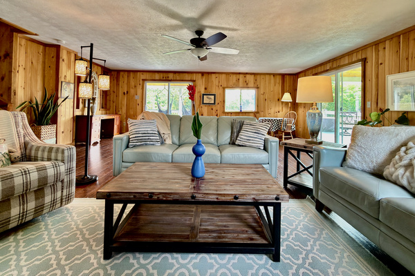 Unwind in our open-concept living room, complete with high-quality leather couches, a TV, and a quiet desk area. Fully climate-controlled for your comfort, this bright space offers seamless indoor-outdoor living with direct deck access. (See notes)