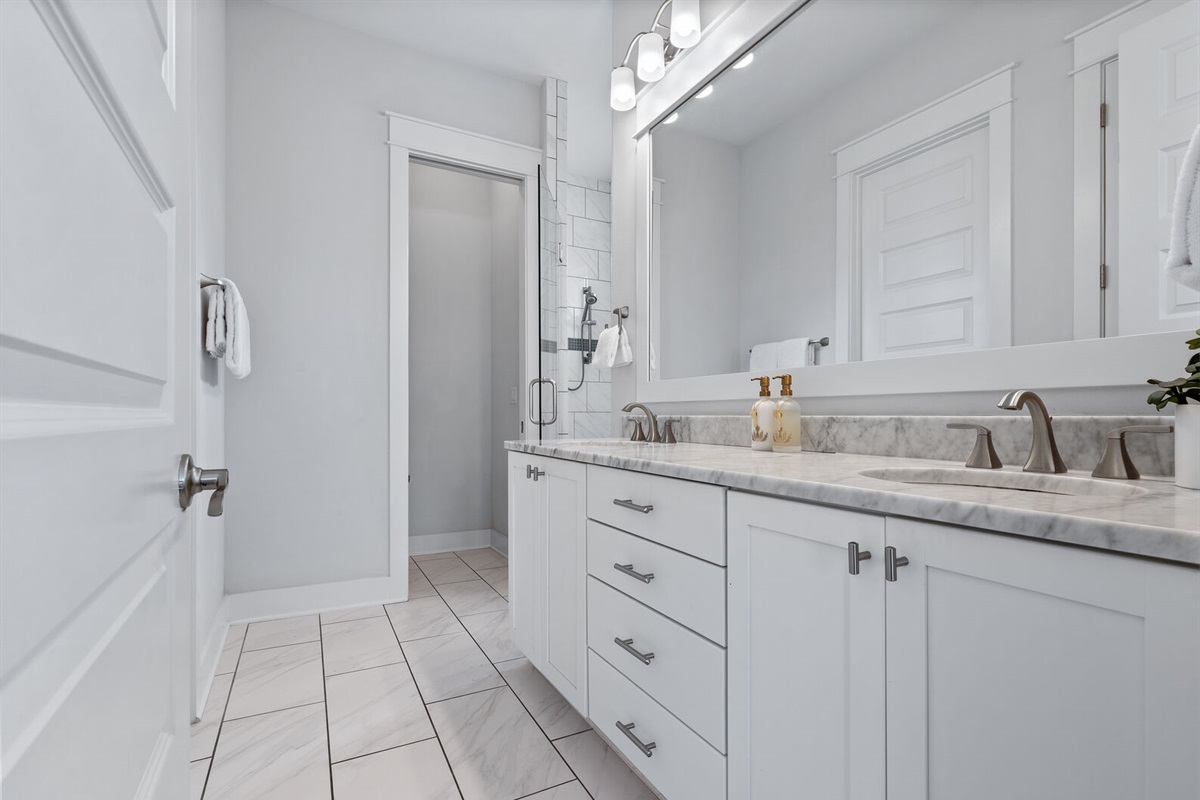 Primary bath with marble double vanity.