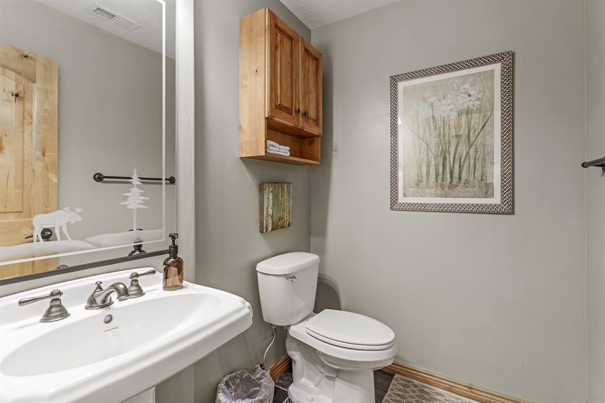 Convenient half bath with clean finishes—perfect for guests and shared spaces.