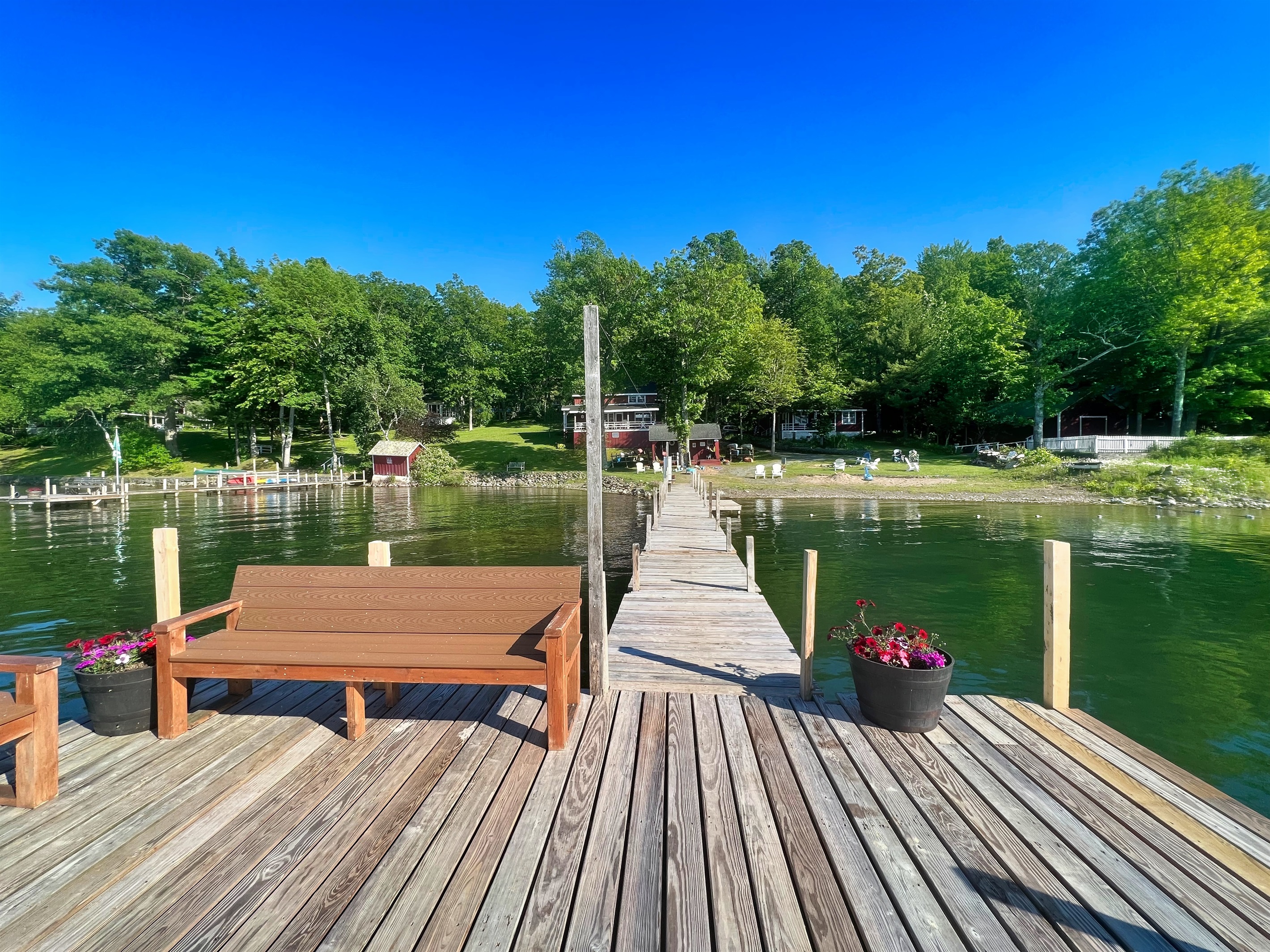 Hyde Bay Colony swim dock with benches to sit and enjoy the view.