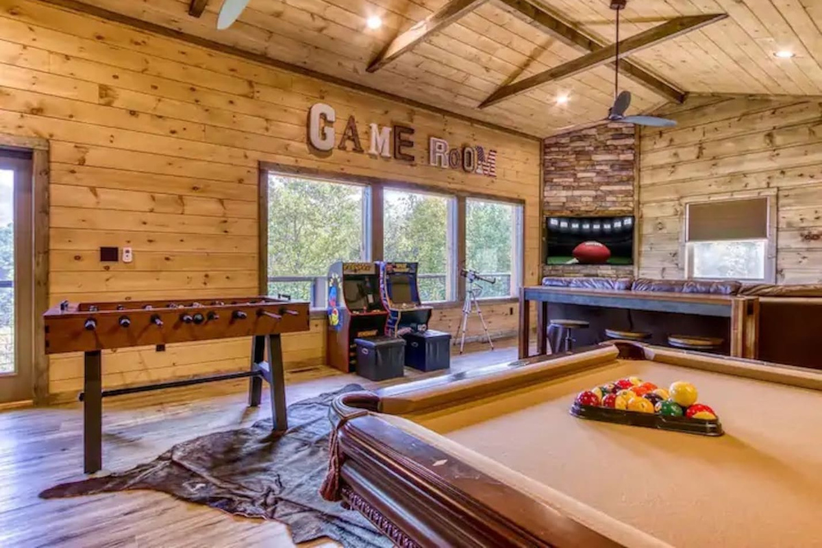 Game room features a pool table, two arcade games with multiple games, comfortable seating, large tv and a retro Nintendo with over 30 games.  Game room is on the third floor
