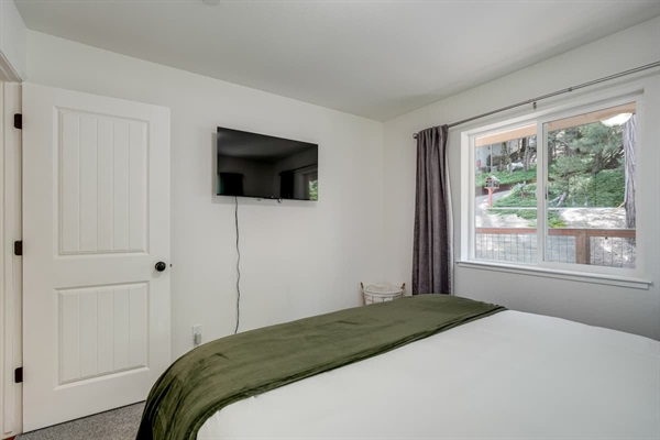 Comfortable sleeping space with TV for relaxing at night