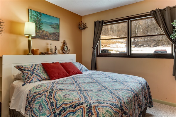 Sunrise at Sea features a comfortable king bed and a fun seaside theme cheerfully out of place in Western Wisconsin!