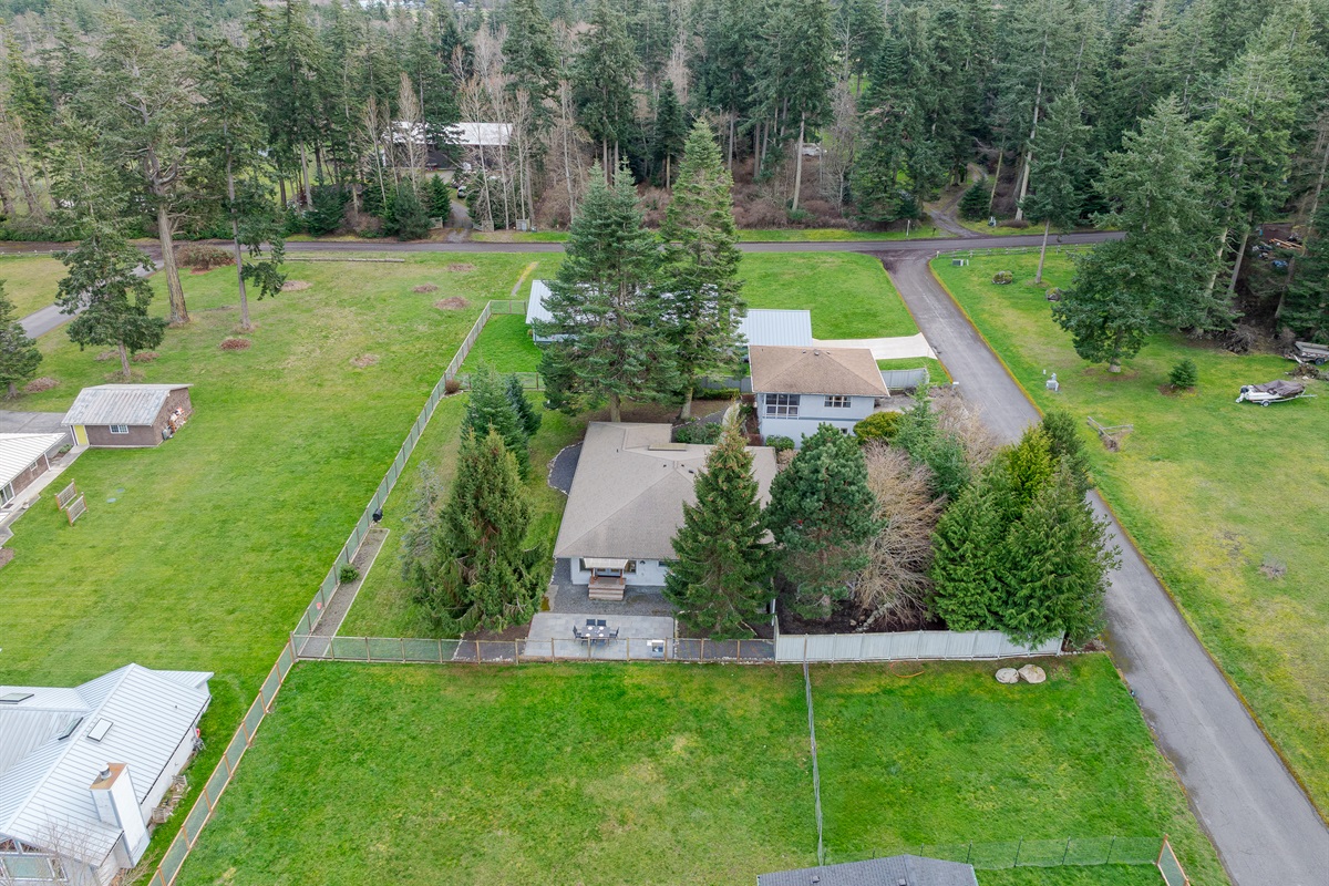 Luxury meets nature on this expansive estate set on emerald lawns and framed by majestic evergreens.