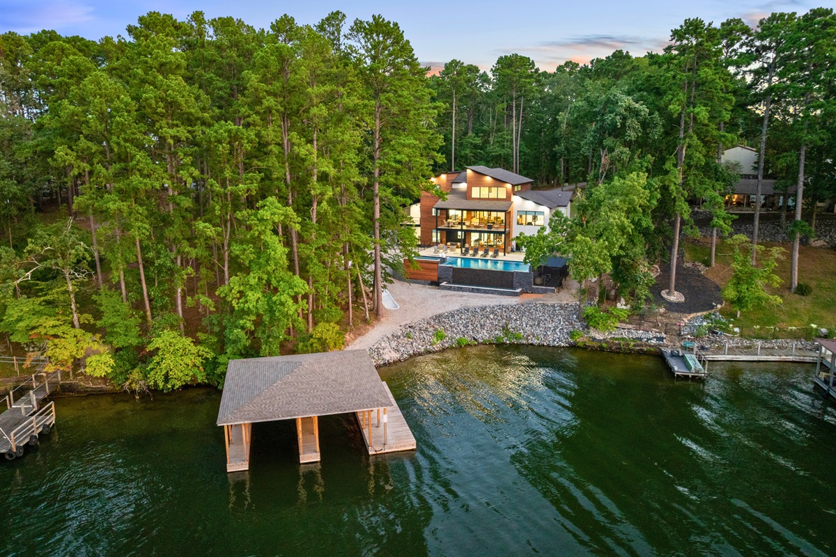 Tucked among the trees, this retreat offers lake access and unmatched privacy.