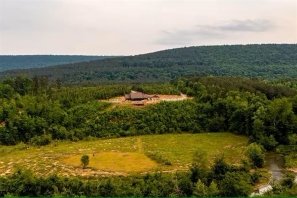 Wide valley views from the cabin—privacy, space, and open skies.