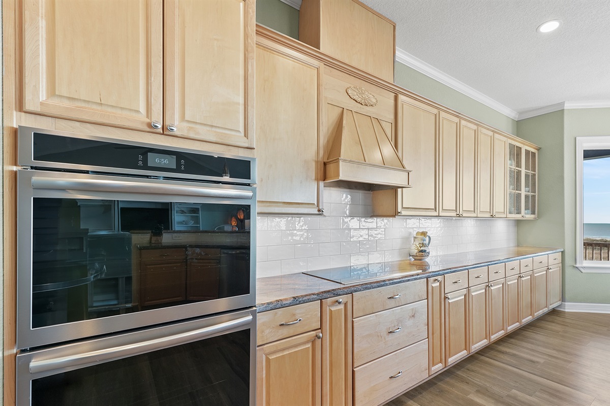 Double ovens and high-end appliances make cooking for a crowd a breeze in this fully-equipped kitchen.