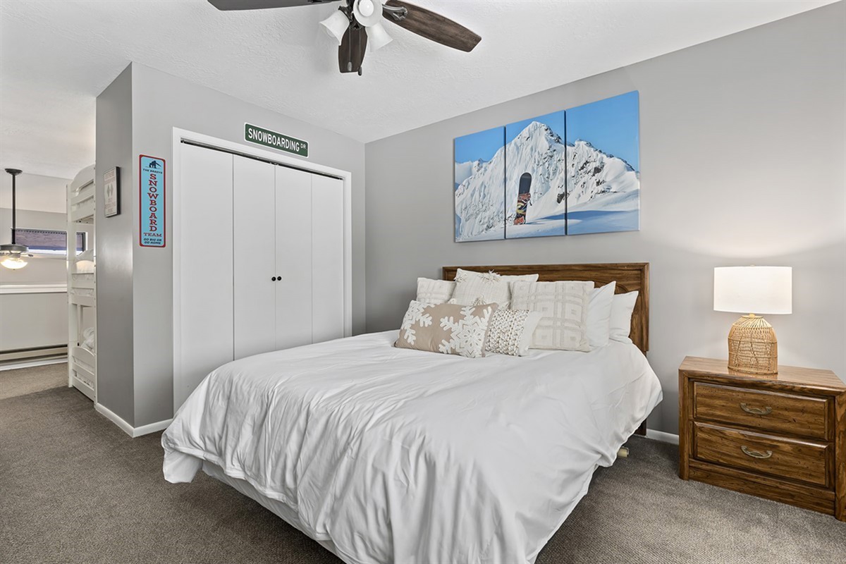 Upstairs queen bedroom offering a quiet, restful escape after adventure-filled days.