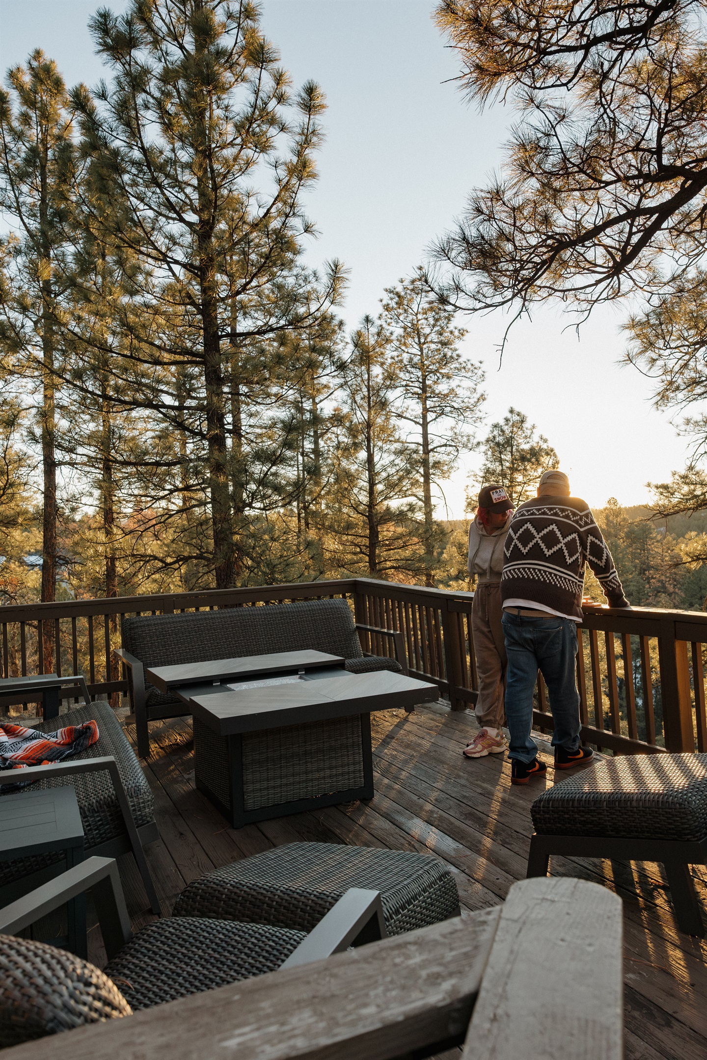 Stunning sunset views from the deck at Poppywood Pines create magical moments surrounded by ponderosa pines. This Show Low cabin offers the perfect vantage point for Arizona's golden hour, ideal for unwinding after White Mountains hiking, fishing, and adve