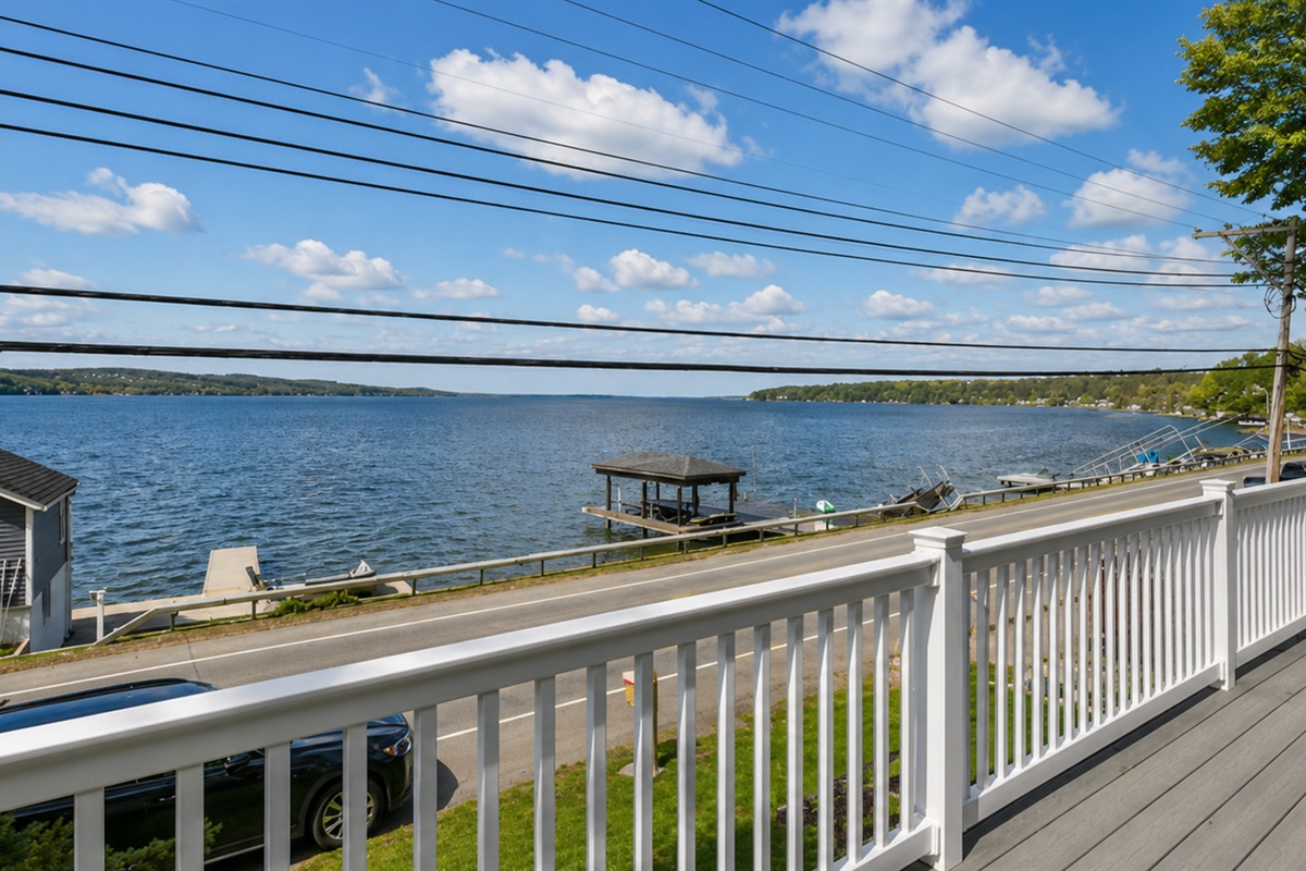 Sip your morning coffee or unwind at sunset while enjoying panoramic views of the lake from this spacious upper-level deck.