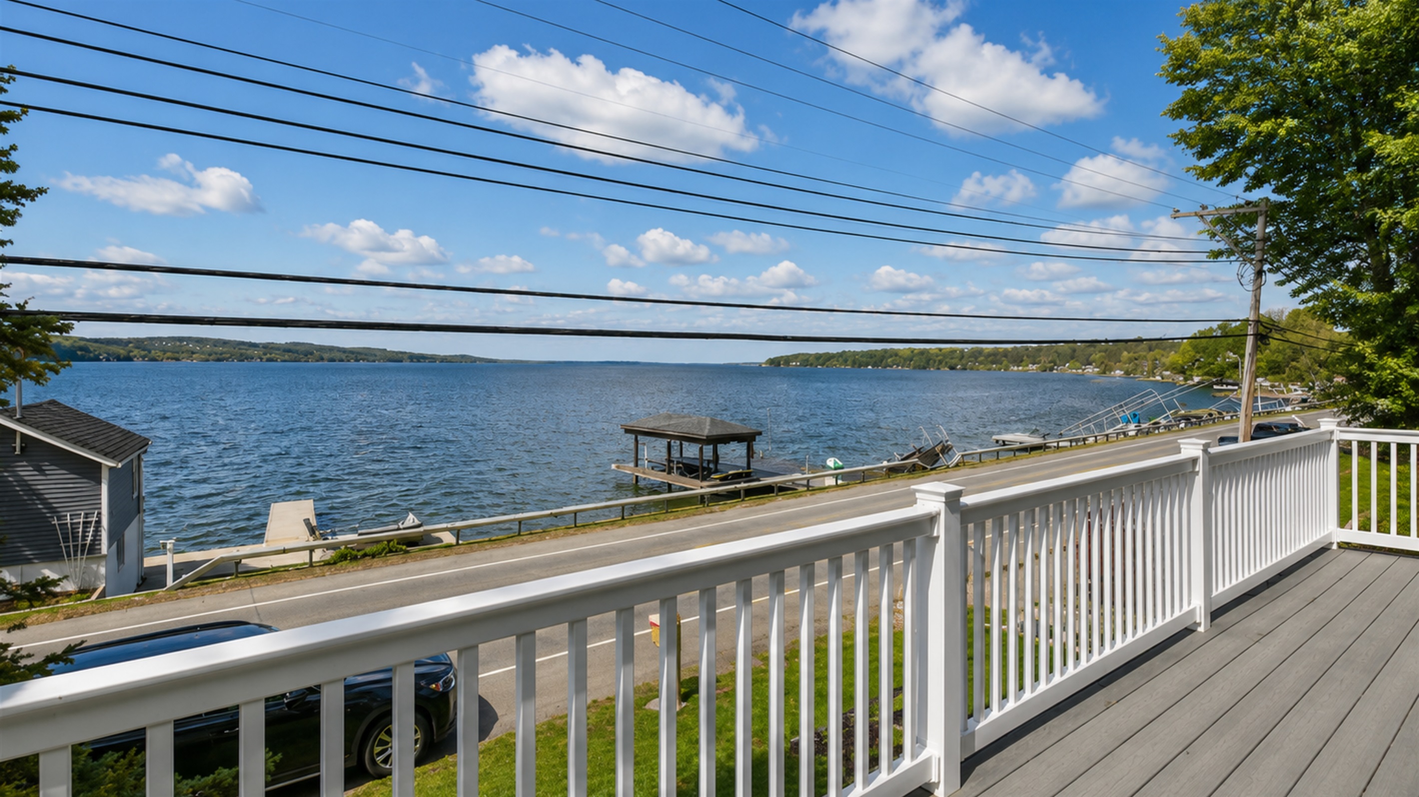 Sip your morning coffee or unwind at sunset while enjoying panoramic views of the lake from this spacious upper-level deck.
