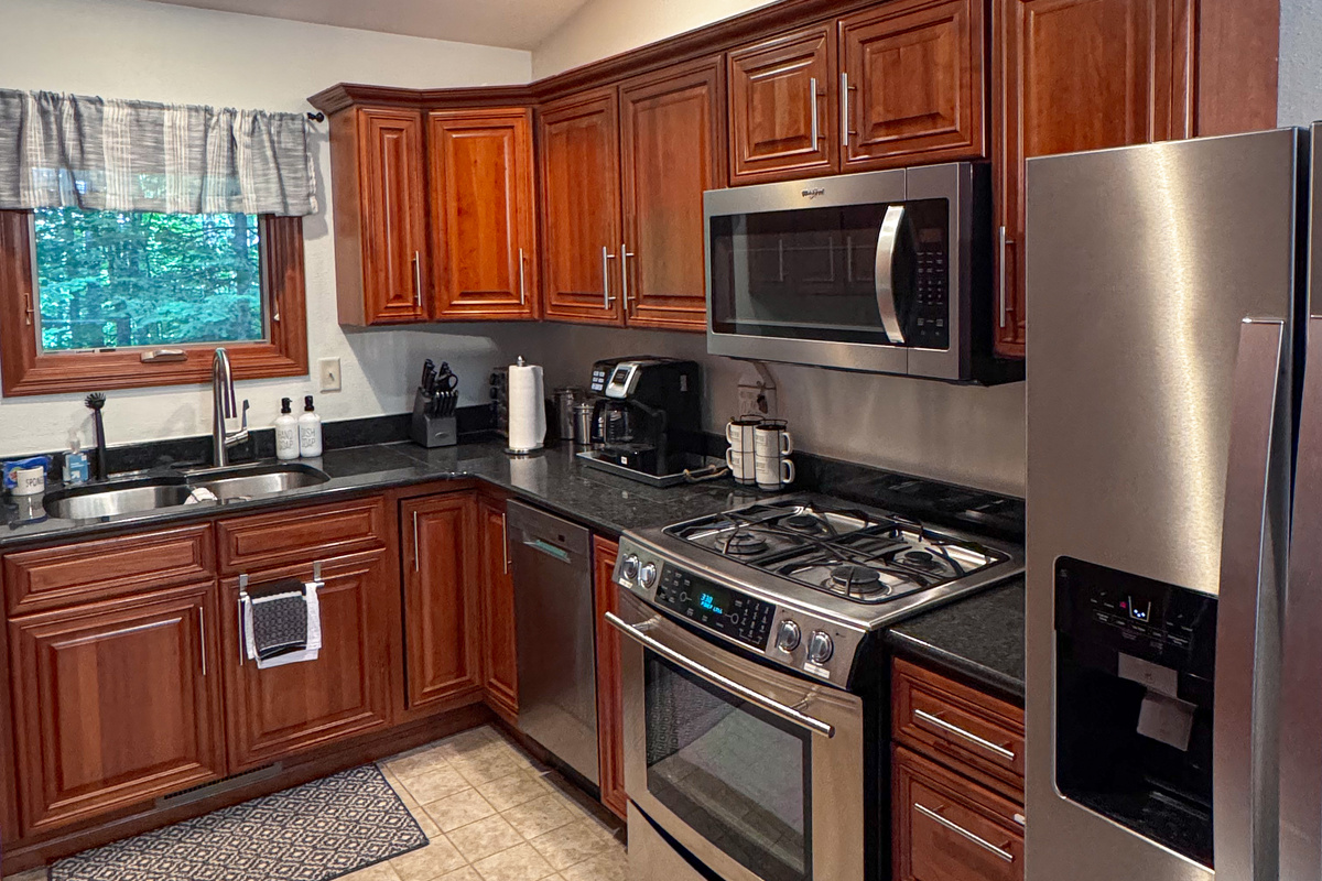 Fully stocked kitchen with granite countertops, stainless steel appliances, oven, dishwasher, toaster, electric skillet provided coffee tea spices  