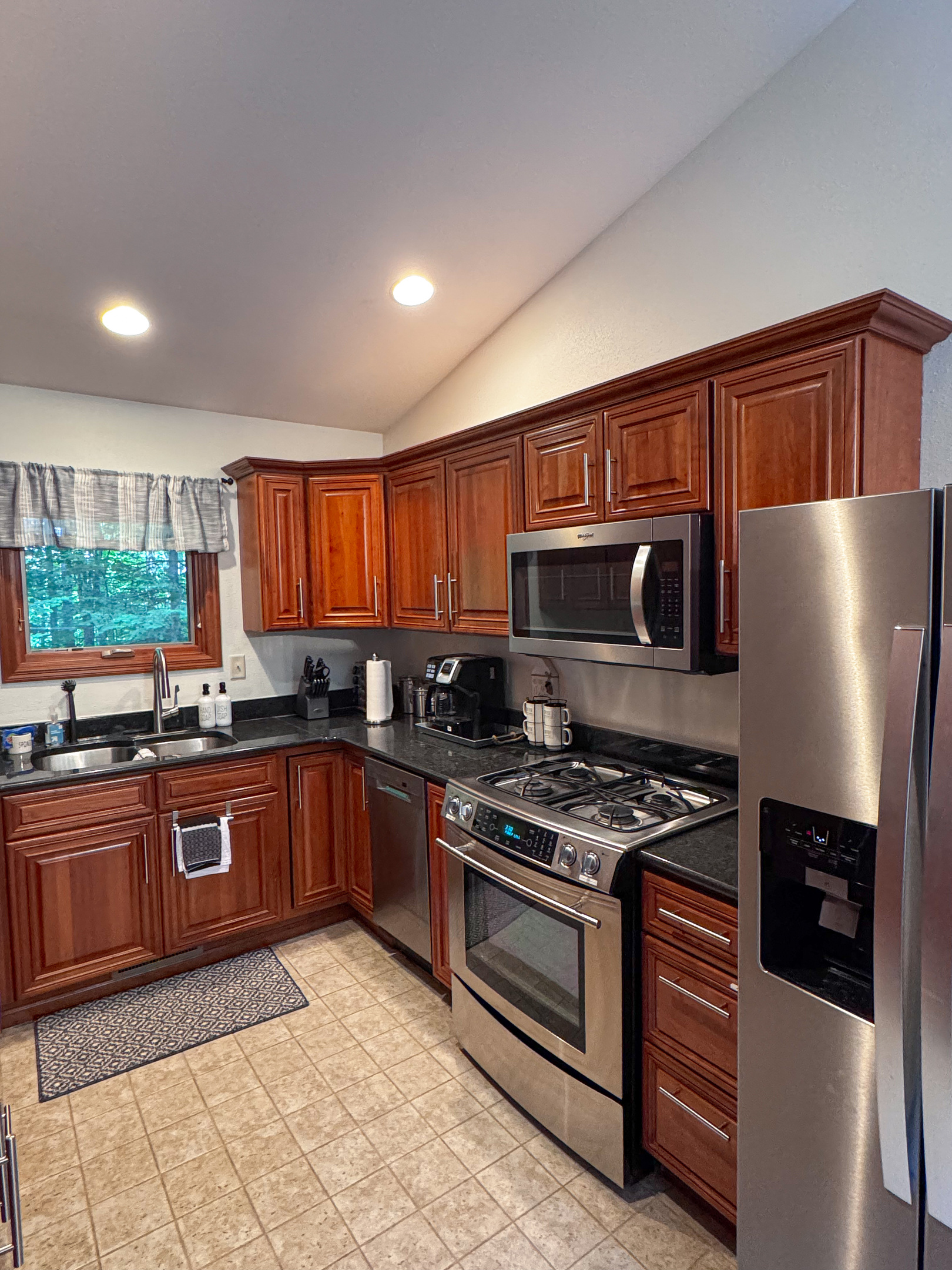 Fully stocked kitchen with granite countertops, stainless steel appliances, oven, dishwasher, toaster, electric skillet provided coffee tea spices  