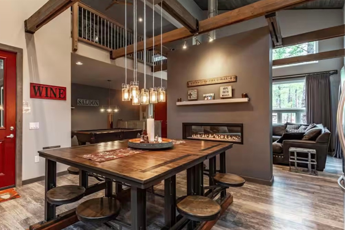 Warm dining area beside the fireplace and entry, perfect for shared meals.