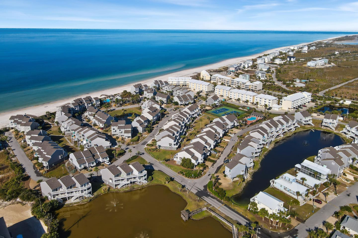 Take in the whole community from above &mdash; pool, courts, boardwalk, and beach all within a short walk of your door.