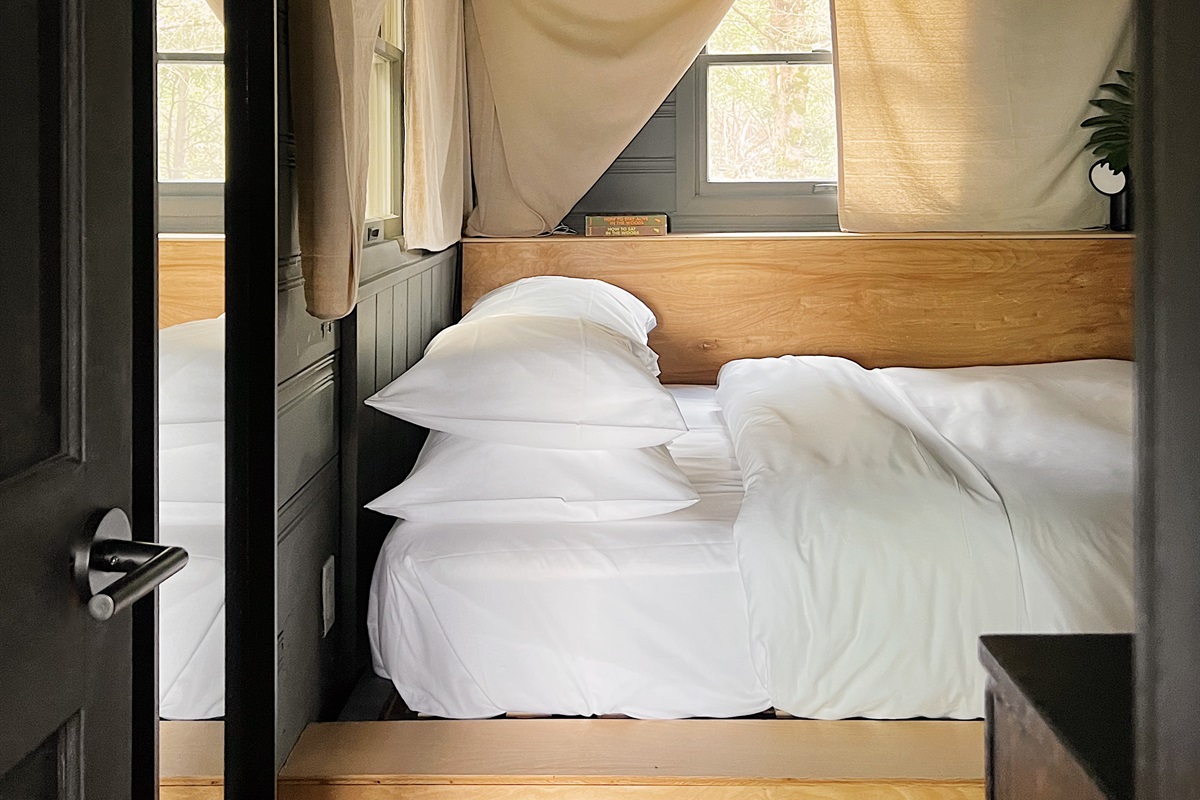 Built-in queen-sized bed with Parachute linens and bedding.