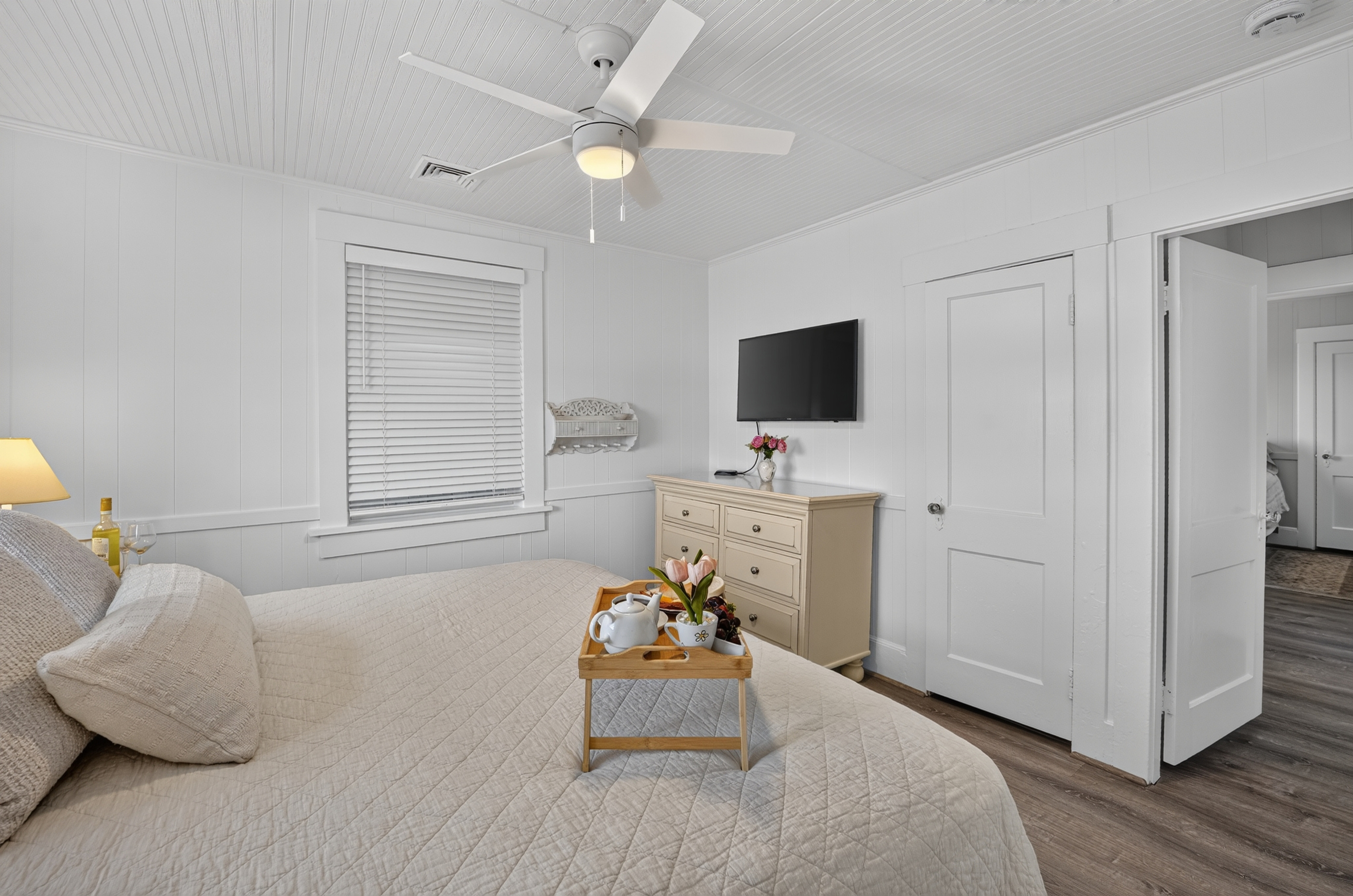Relax in a bright and airy bedroom complete with a smart TV and peaceful coastal charm.