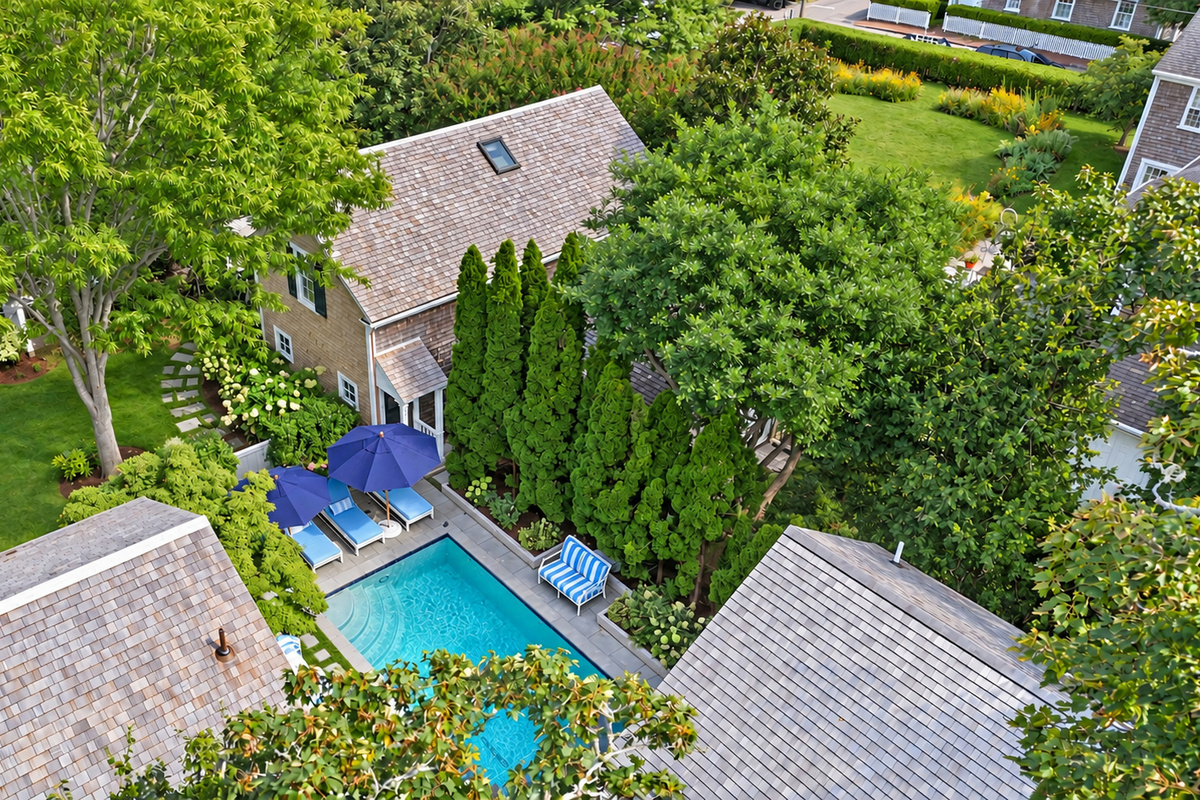 Aerial view of the property and pool