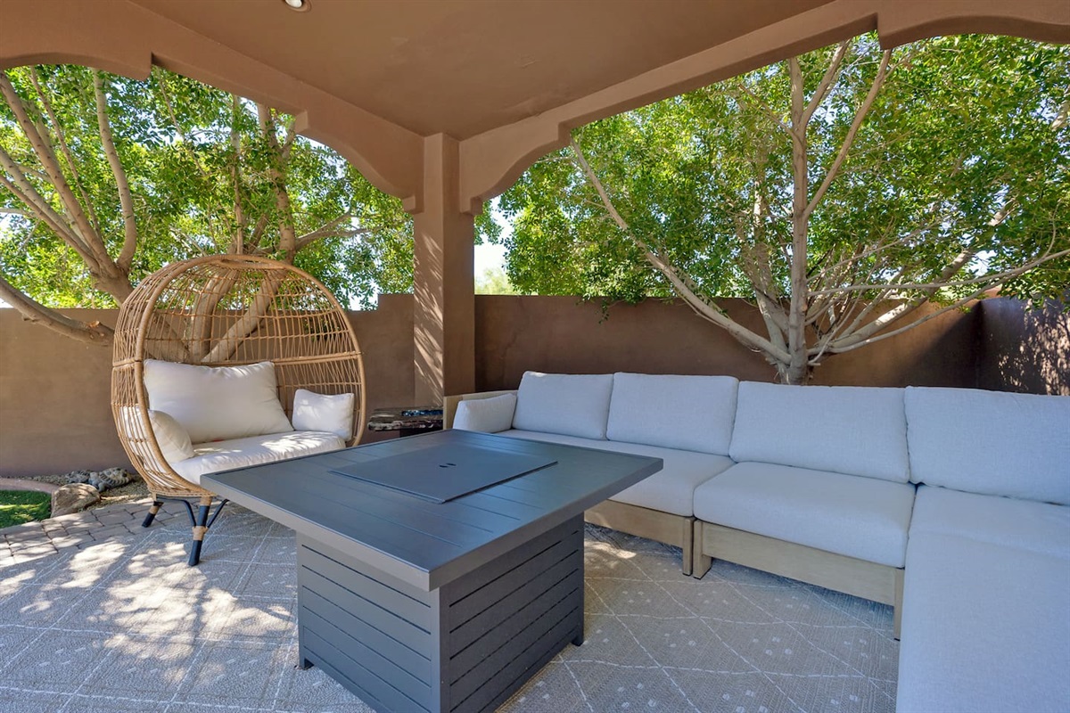 Relaxing, second outdoor seating area offers privacy & comfort for all.