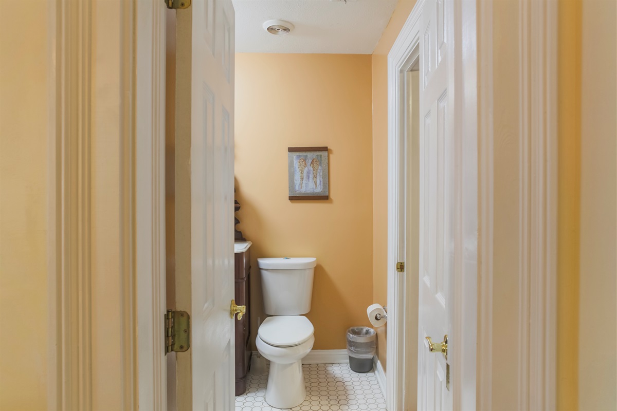This ensuite bath conveniently connects the king bedroom and dining room, offering easy access from both spaces.
