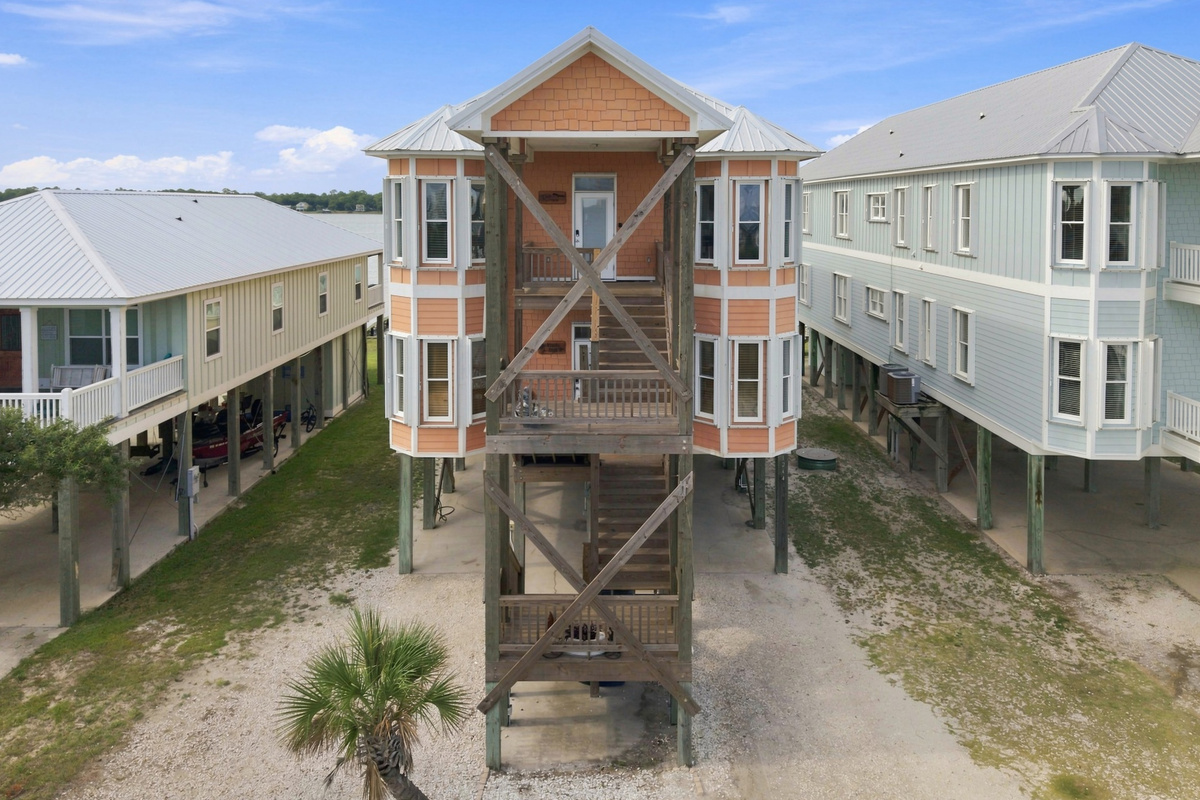 Striking multi-level elevation with covered parking below