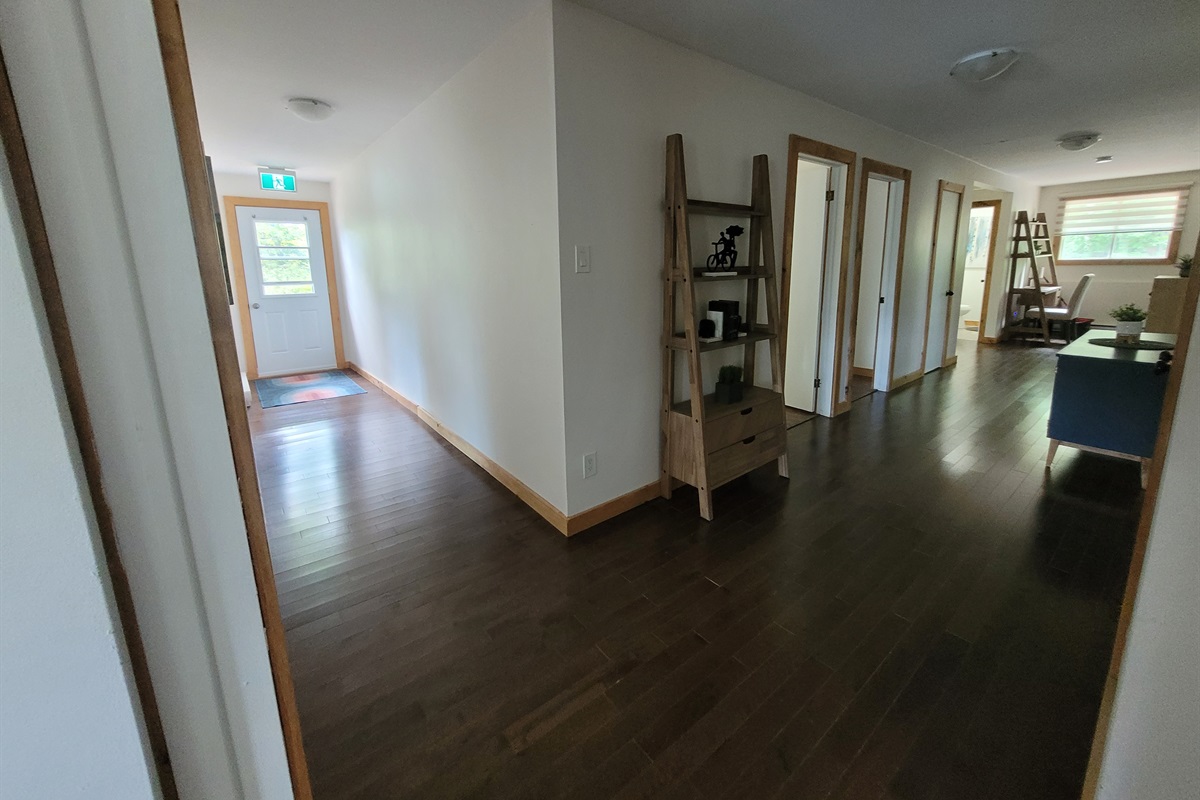 Upstairs hallway with exit to outside stairs
