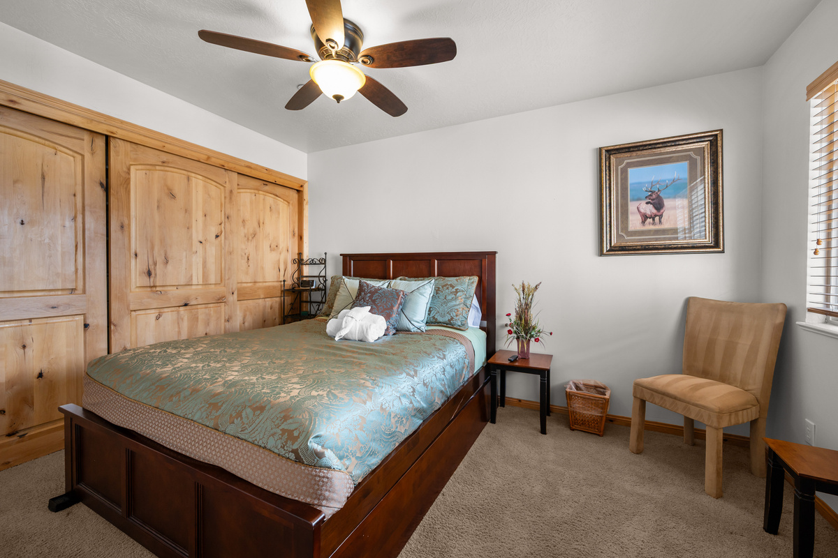 The second bedroom has a double closet and lush bedding for a restful sleep. The second bedroom also has a trundle