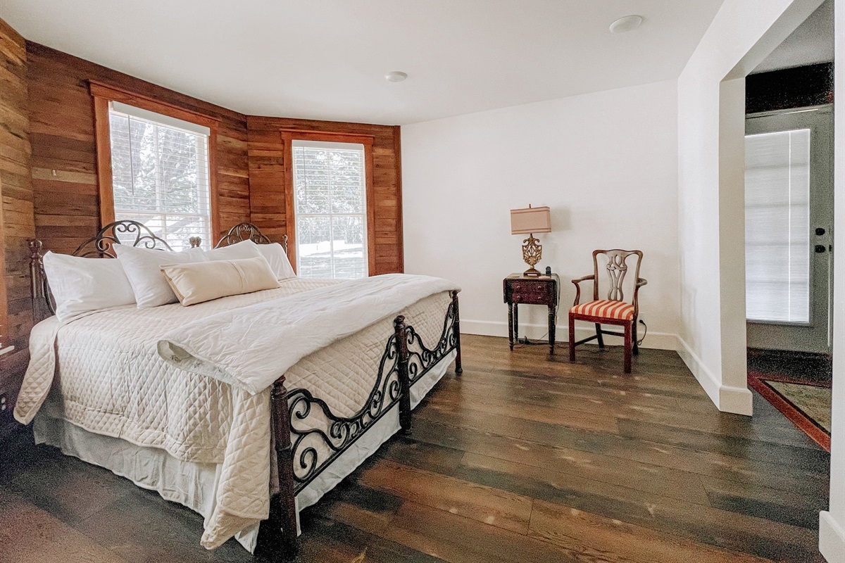 The first bedroom downstairs has a King size bed and a private bathroom.