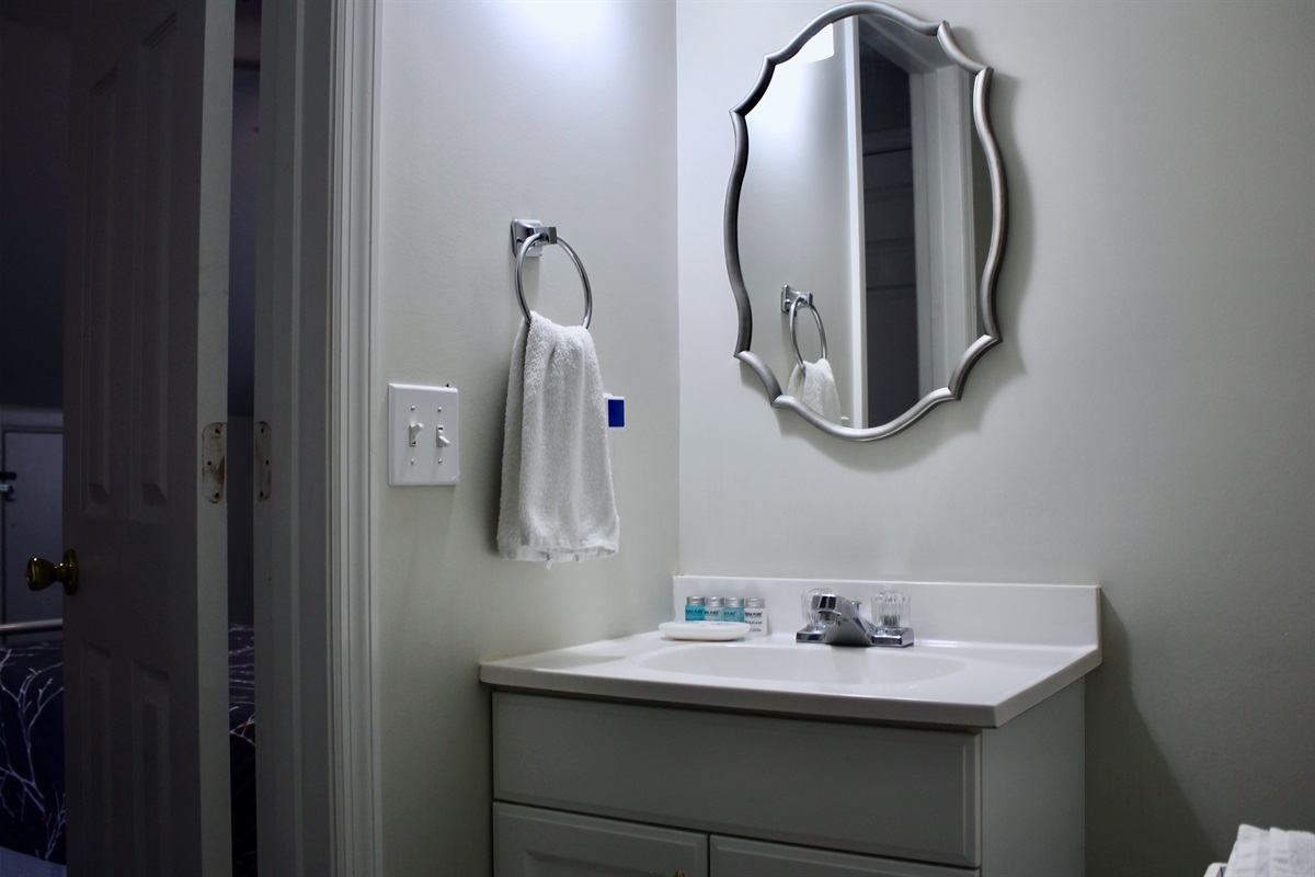A stylish half bath in the loft—perfect for convenience and privacy.