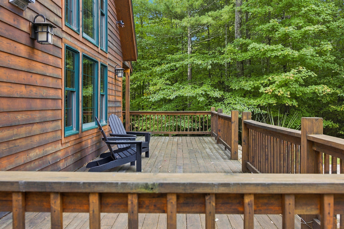 The spacious wraparound deck is perfect for morning coffee and peaceful evenings outdoors.