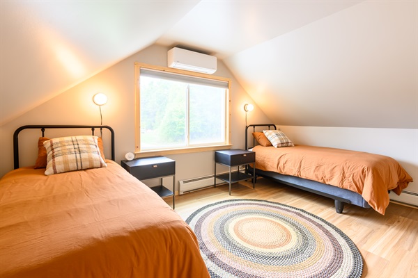 Upstairs, the additional upstairs bedroom features 2 twin XL helix midnight luxe mattresses