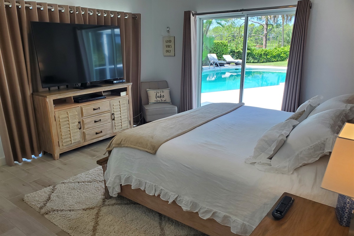 Master King bedroom with smart TV and access to pool
