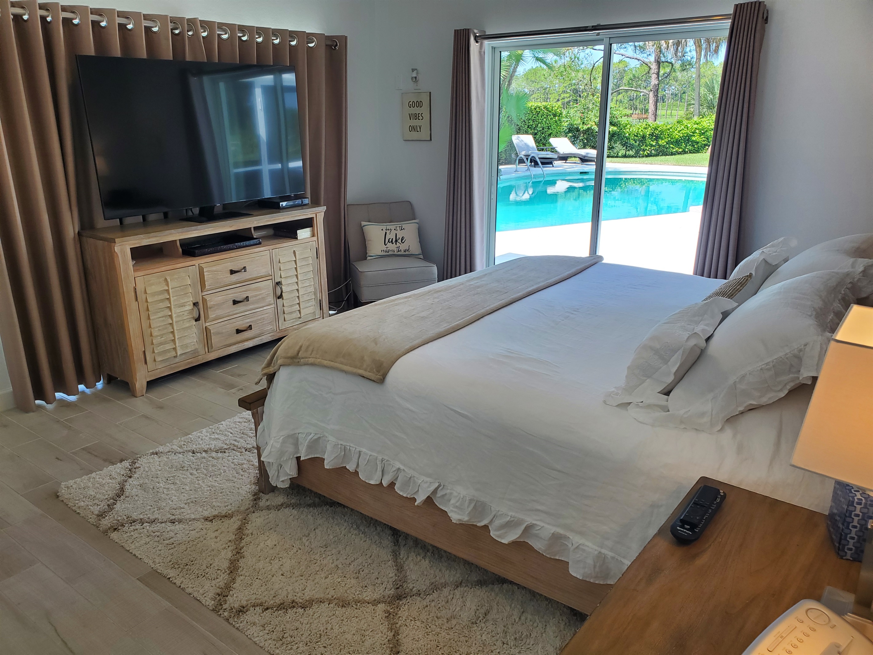 Master King bedroom with smart TV and access to pool
