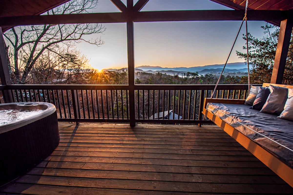 Walk out onto the upper deck through a wall of glass and take in unbelievable sunrises from the hot tub or bed swing!