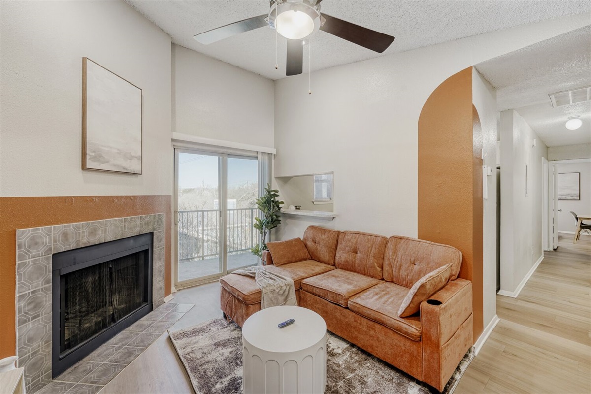 Warm tones and modern comfort meet in this cozy living space.