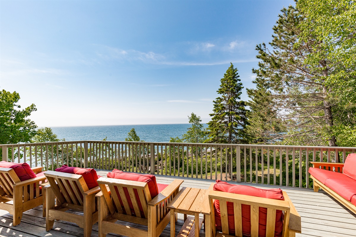 Imagine stepping out onto the deck just after sunrise over Lake Superior. You sink into one of the big cushioned loungers, the kind that instantly relaxes your whole body and suddenly it feels like the entire shoreline belongs to you.