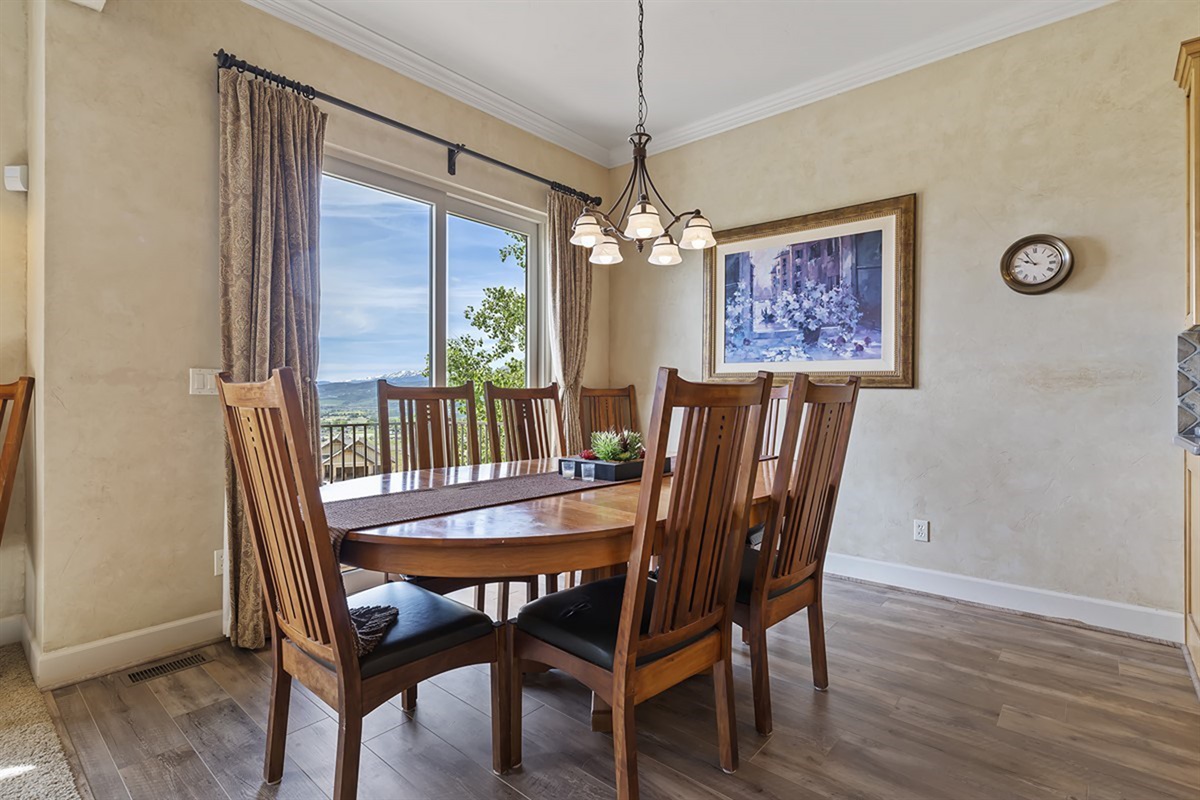 Sunlit dining space with peaceful alpine views