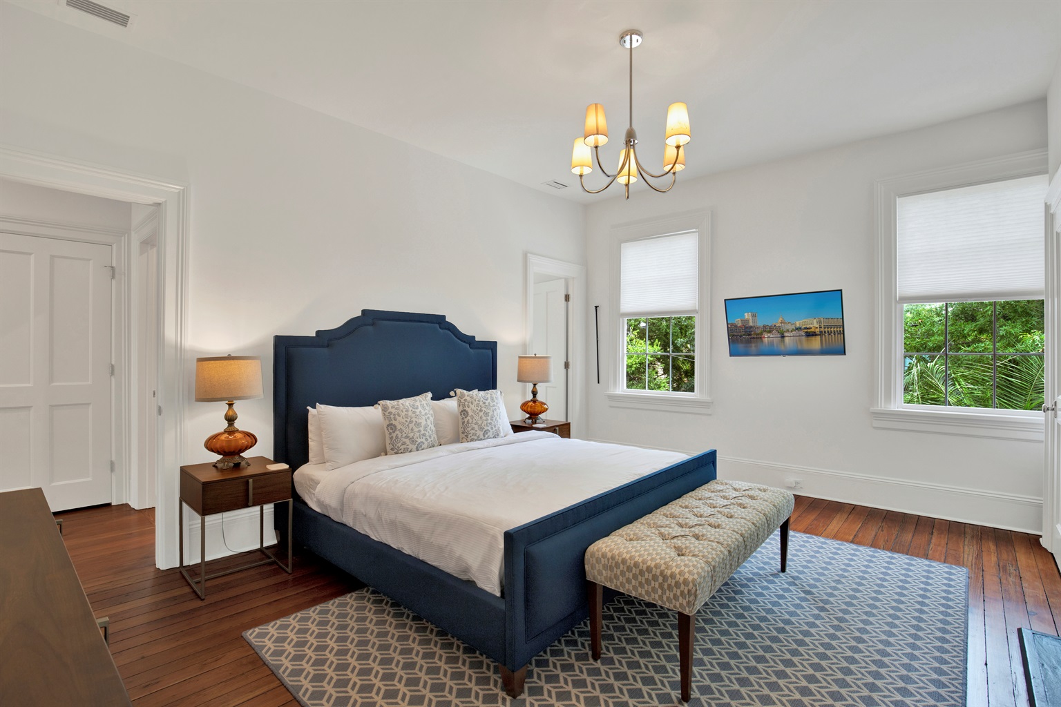Queen bed with soft linens + thoughtful design details.