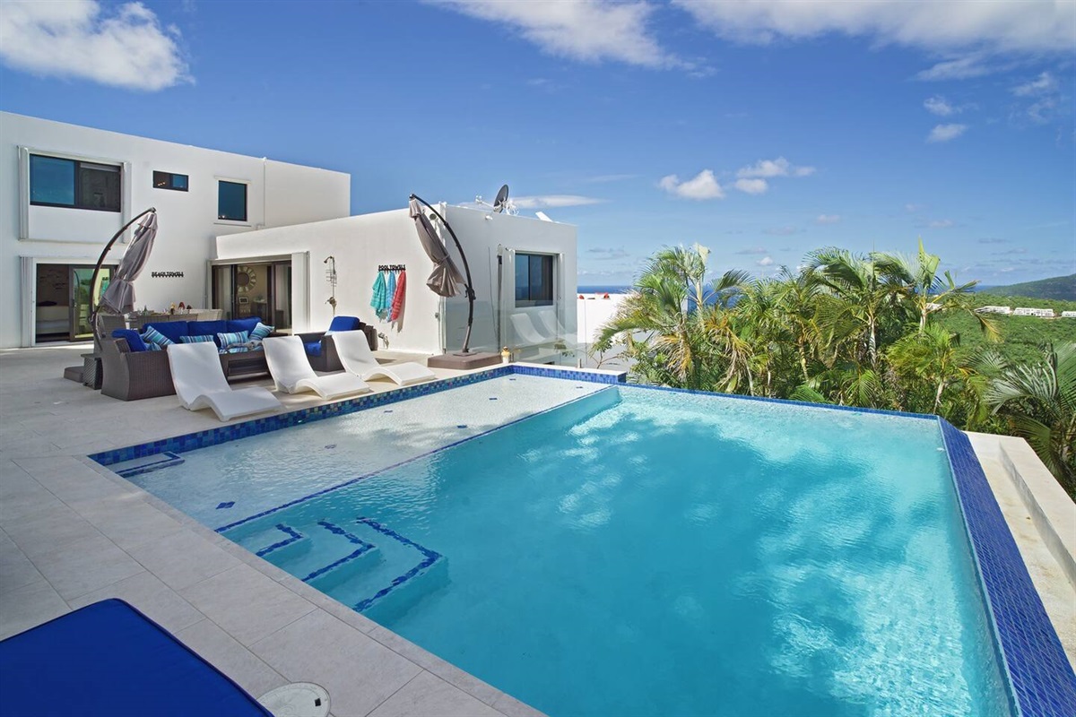 Unwind poolside and enjoy the serene tropical ambiance.