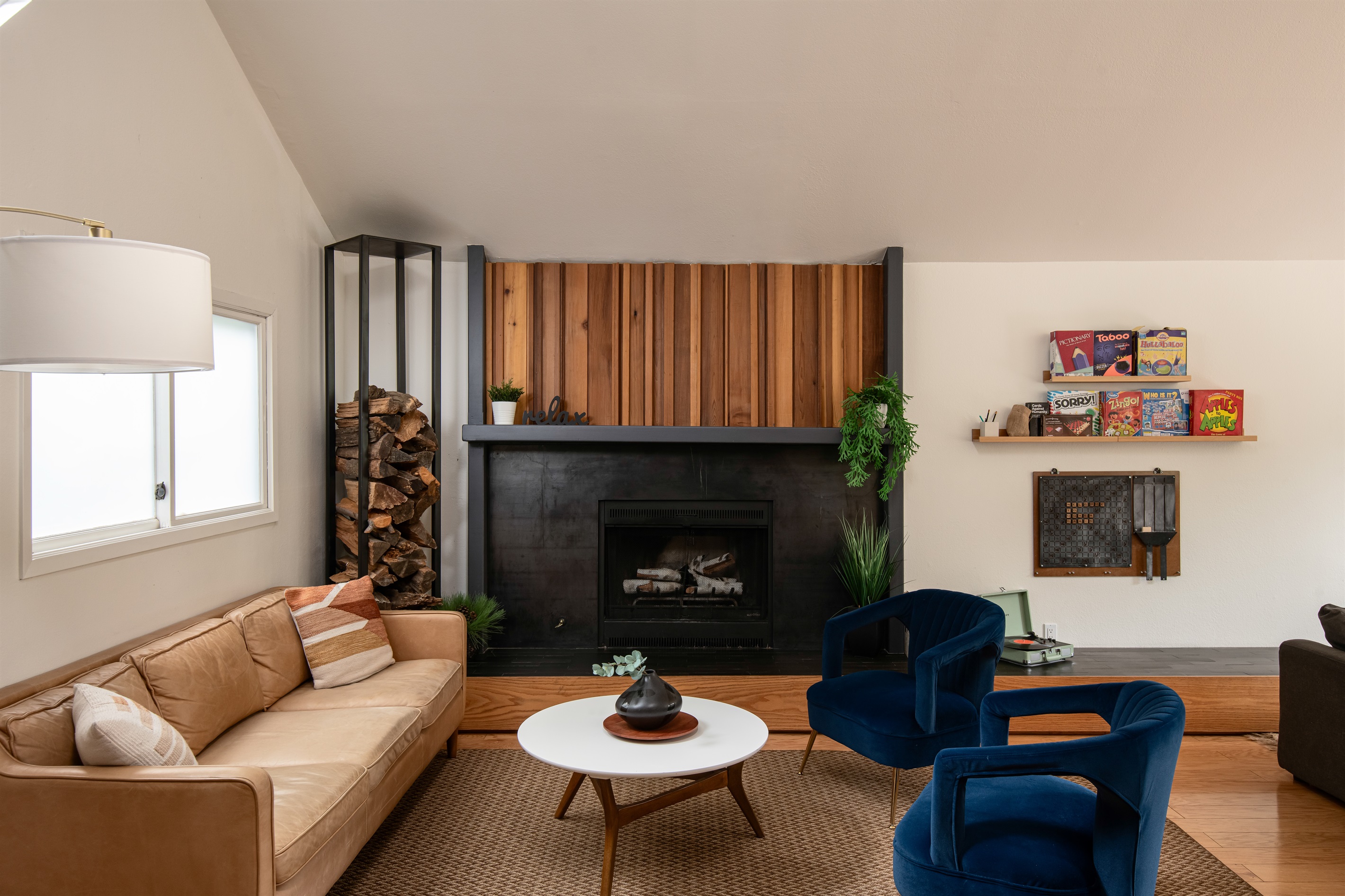 Relax in a comfortable living space centered around the fireplace—perfect for unwinding, spending time together, and enjoying quiet nights in.