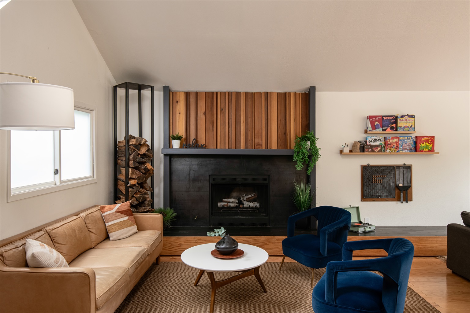 Relax in a comfortable living space centered around the fireplace—perfect for unwinding, spending time together, and enjoying quiet nights in.