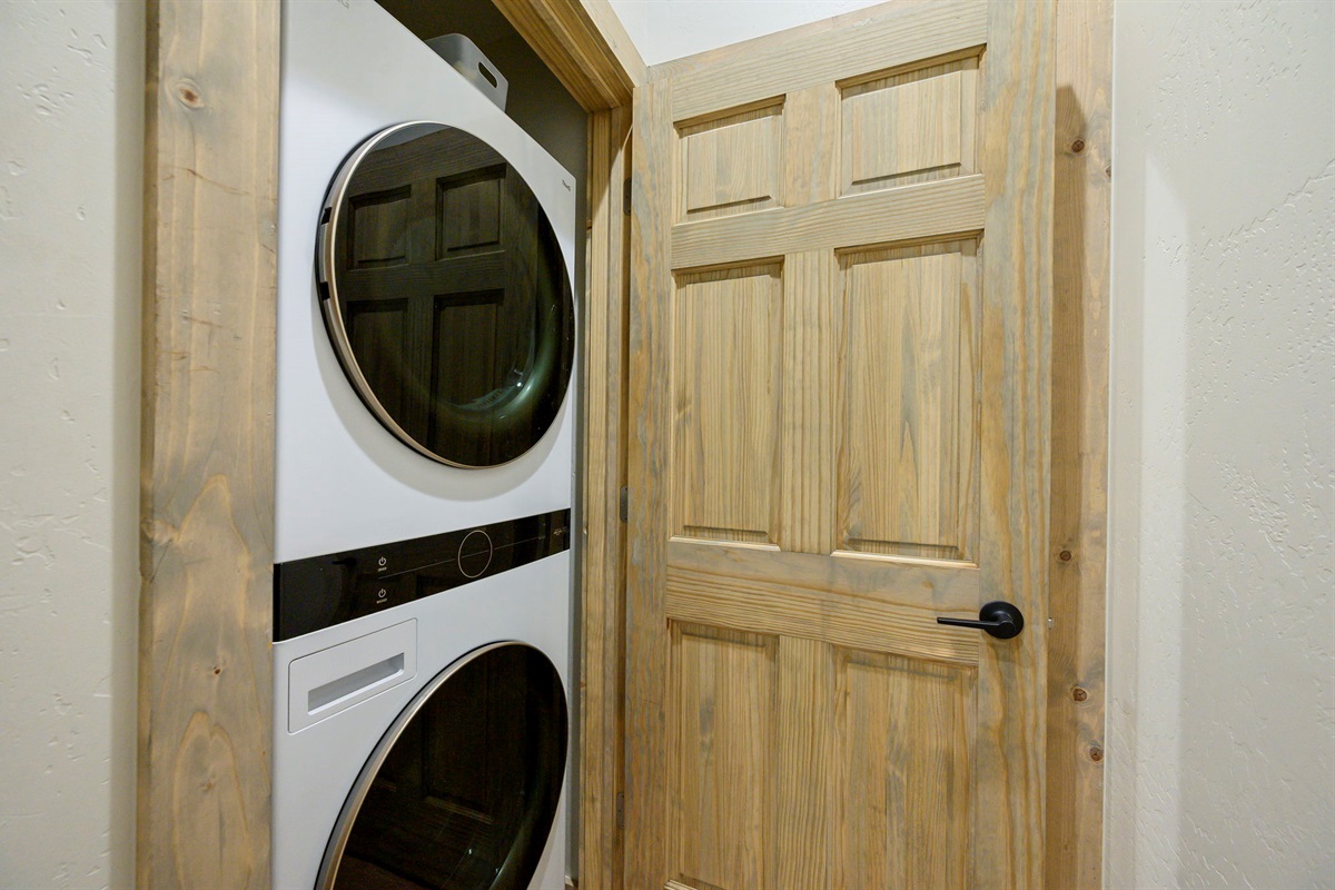 Full-size stacked washer & dryer for added convenience during longer stays.