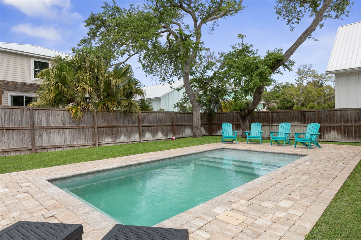 Relax poolside in your private fenced backyard oasis.