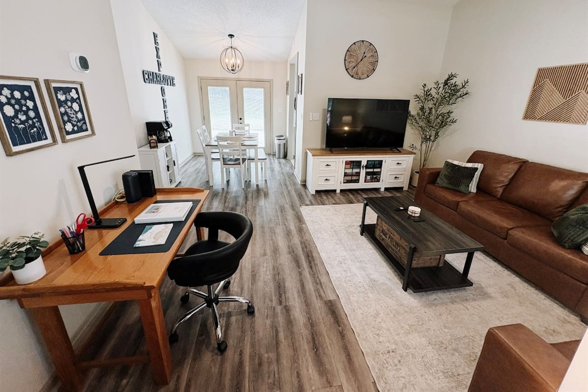Living Room with 65" Smart TV, dedicated workspace, cards, board games and cozy seating!