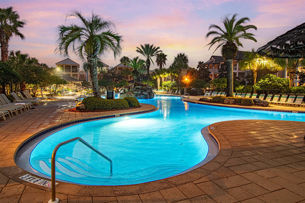 The zero-entry lagoon pool glows at night. The kids won't want to leave and honestly, neither will you.