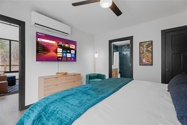 Bedroom Retreat: Sleep in comfort and style with a Roku TV, luxurious bedding, and serene nature views!