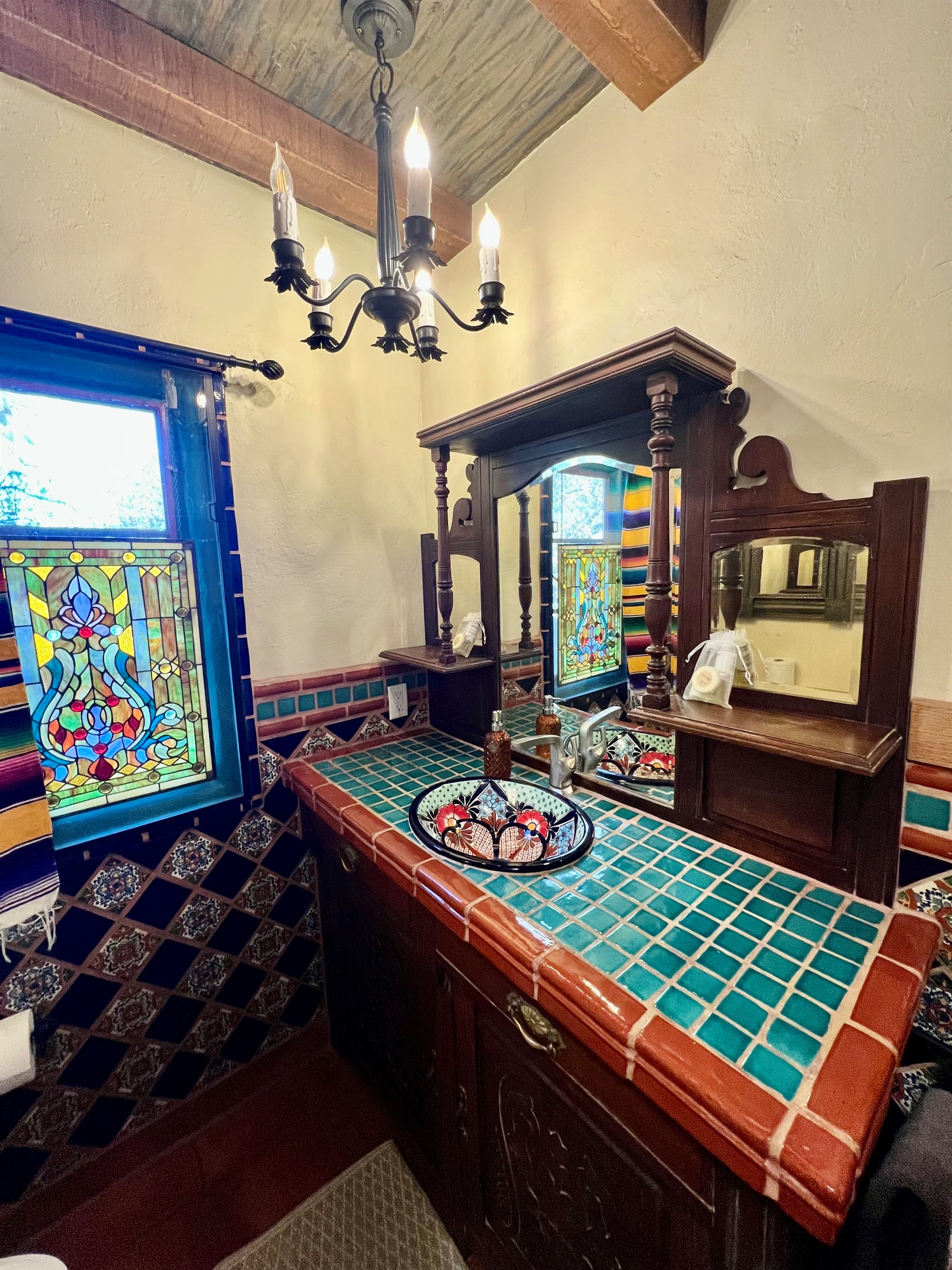 Experience the beauty of authentic tilework in this bathroom, showcasing vibrant colors and traditional patterns.